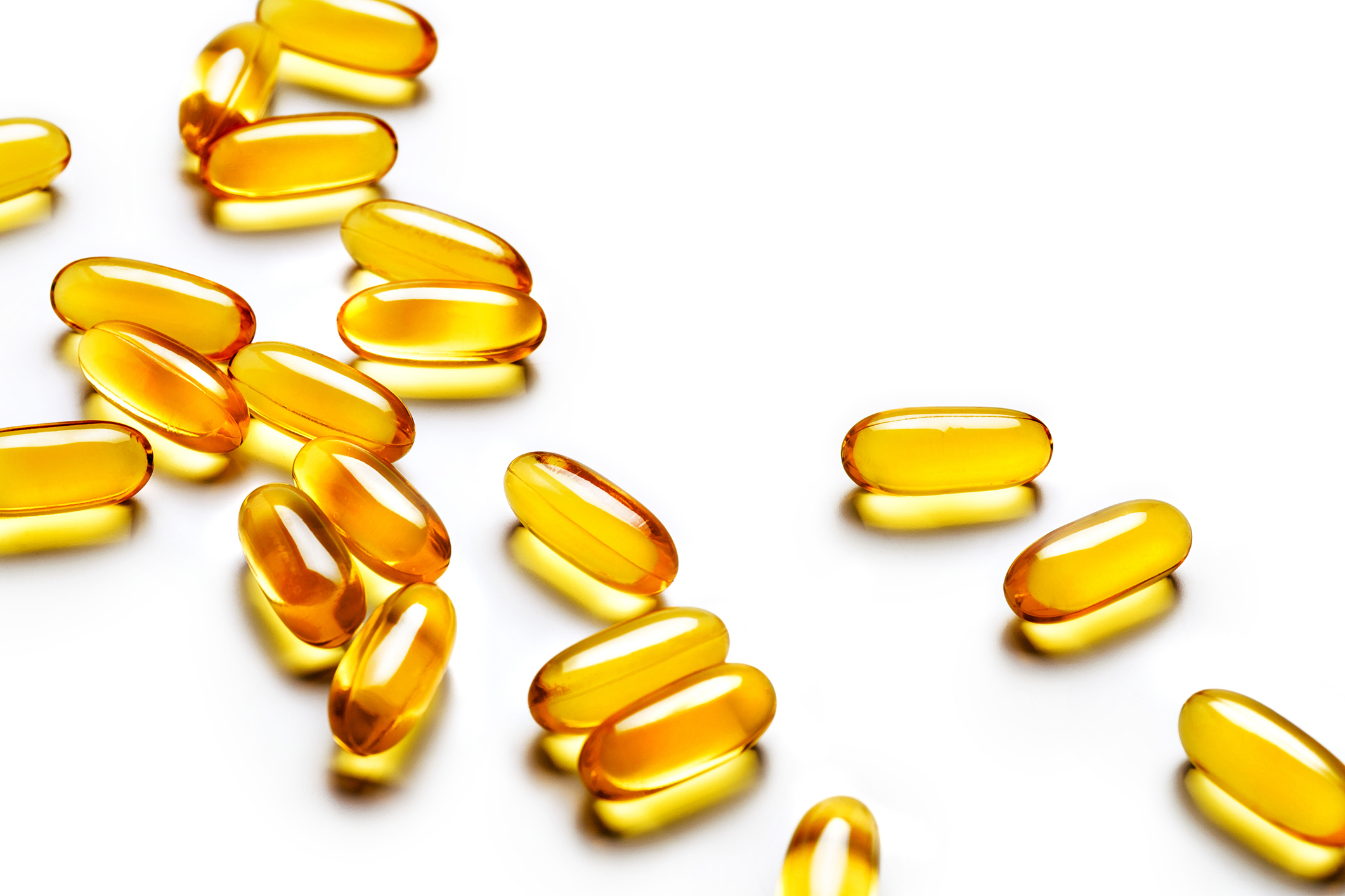vitamin e capsules on a white background